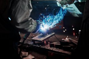 Industrial factory weld worker. Welding or welder master weld the steel